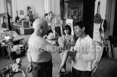 Pablo Picasso introduces Claude Picasso and Paloma Picasso to a new pet, a talking parrot, which is squatting on his arm. La Californie, Cannes 1960. - Photo by Edward Quinn