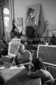Paloma Picasso watching her father Pablo Picasso dedicating "Faune (Pour mon ami E. Quinn) see Pic600664. La Californie, Cannes 1960. - Photo by Edward Quinn