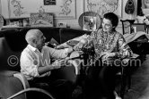 Pablo Picasso and Jacqueline with their Easter presents. Jacqueline is wearing a blouse made from a textile designed by Pablo Picasso. La Californie, Cannes 1961. - Photo by Edward Quinn