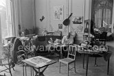 Pablo Picasso working on "Oeuf de pâques" with Caran d'ache wax oil pastels. In the forground a table by Joseph-Marius Tiola. La Californie, Cannes 1961. - Photo by Edward Quinn