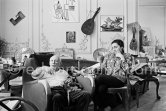 Pablo Picasso and Jacqueline (she is wearing a blouse made from a textile designed by Pablo Picasso) with dachshund Ma Jolie. La Californie, Cannes 1961. - Photo by Edward Quinn