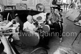 Pablo Picasso and Jacqueline (she is wearing a blouse made from a textile designed by Pablo Picasso) with dachshund Ma Jolie. La Californie, Cannes 1961. - Photo by Edward Quinn