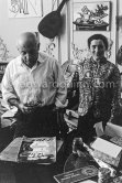 Pablo Picasso working on gouache with Caran d'Ache wax oil pastels and water color. Pablo Picasso always liked surprises and in his work he encouraged unpredictable outcomes. Jacqueline is wearing a blouse made from a textile designed by Pablo Picasso. La Californie, Cannes 1961. - Photo by Edward Quinn