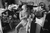 Pablo Picasso with a glass object of Egidio Costantini de la Fucina Degli Angeli (see Pic531407, MPParis:1950.4.1). A table by Joseph-Marius Tiola in the background. La Californie, Cannes 1961. - Photo by Edward Quinn