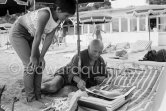 Pablo Picasso and Paloma Picasso viewing the dummy for the book "Pablo Picasso at Work" by Edward Quinn. Golfe-Juan 1961. - Photo by Edward Quinn