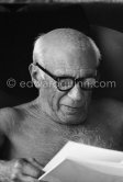 Pablo Picasso viewing a book on himself. La Californie, Cannes 1961. - Photo by Edward Quinn