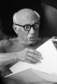 Pablo Picasso viewing a book on himself. La Californie, Cannes 1961. - Photo by Edward Quinn
