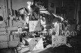 The proverbial disorder of the rooms in which Pablo Picasso works is unique. Beside the large pieces of sculpture in painted iron and plaster hang portraits of Jacqueline and Paloma Picasso surrounded by drawings, objects and notes pinned to the wall. La Californie, Cannes 1961. - Photo by Edward Quinn