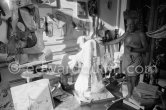 The proverbial disorder of the rooms in which Pablo Picasso works is unique. Beside the large pieces of sculpture in painted iron and plaster hang portraits of Jacqueline and Paloma Picasso surrounded by drawings, objects and notes pinned to the wall. La Californie, Cannes 1961. - Photo by Edward Quinn