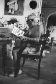 Pablo Picasso with the book of André Verdet, "Griffe de Pablo Picasso". Editions Parler 1961. - Photo by Edward Quinn
