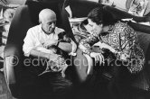 Easter time at La Californie. Pablo Picasso and Jacqueline enjoy a quiet Moment, Picasso holding Ma Jolie in his arms. Jacqueline is wearing a blouse made from a textile designed by Picasso. Picasso and Jacqueline Roque married in 1961. This photographs are taken a month later, the first pictures after their wedding. Cannes 1961. - Photo by Edward Quinn