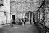 Pablo Picasso and his dogs Kaboul and Lump on the terrace in front of the entrance to Mas Notre-Dame-de-Vie, Mougins 1962. - Photo by Edward Quinn