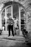 Picasso and Jacqueline with Afghan dog Kaboul on the terrace in front of the entrance to Mas Notre-Dame-de-Vie, Mougins, 14 Feb 1962. - Photo by Edward Quinn