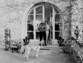 Pablo Picasso and Jacqueline with Afghan dog Kaboul on the terrace in front of the entrance to Mas Notre-Dame-de-Vie, Mougins 14.2.1962. - Photo by Edward Quinn