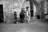 Pablo Picasso and Jacqueline with Afghan dog Kaboul on the terrace in front of the entrance to Mas Notre-Dame-de-Vie, Mougins 14.2.1962. - Photo by Edward Quinn