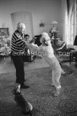 Pablo Picasso and Jacqueline with Afghan dog Kaboul and dachshund Lump. Mas Notre-Dame-de-Vie, Mougins 14.2.1962. - Photo by Edward Quinn