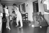 Pablo Picasso watching Catherine Hutin and Claude Picasso dancing the Twist in a restautant at Mougins 1962. - Photo by Edward Quinn