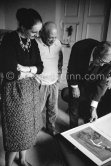 Pablo Picasso, Angela and Siegfried Rosengart viewing a portfolio with early works. Mas Notre-Dame-de-Vie, Mougins 1964. - Photo by Edward Quinn