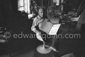 Pablo Picasso with the book "Pablo Picasso at Work" by Edward Quinn, dedicated by Pablo Picasso and Edward Quinn "Pour Jacqueline Kennedy". In the background TV-table by Tiola. Mas Notre-Dame-de-Vie, Mougins 1964. - Photo by Edward Quinn