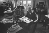 Roland Penrose and Pablo Picasso viewing the book "Pablo Picasso at work" by Edward Quinn with pictures of "La plage à la Garoupe II". Mas Notre-Dame-de-Vie, Mougins Oct 28 1964. - Photo by Edward Quinn