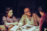 Pablo Picasso, Jacqueline and Mila Gagarine viewing the layout of the newest "Le Zervos", the catalogue raisonné of the works of Pablo Picasso. Visit of Mila Gagarine (Cahiers d'art) and William (Bill) Rubin, MoMA. One of the last photos of Pablo Picasso by Edward Quinn. Mas Notre-Dame-de-Vie, Mougins 7. Jan 1972. - Photo by Edward Quinn