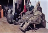 Sicilian marionette in golden armour, "Femme enceinte" and "Tête de mort". Studio de la sculpture. Ground floor, Mas Notre-Dame-de-Vie, Mougins 1974. (Photographed after Pablo Picasso’s death.) - Photo by Edward Quinn