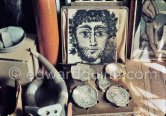 Close-up of the corner of the studio. Pablo Picasso has arranged pieces of antique ceramics in front of his portrait of a faune. Mas Notre-Dame-de-Vie, Mougins 1974. (Photographed after Pablo Picasso’s death.) - Photo by Edward Quinn