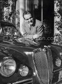 Car enthusiast Prince Rainier of Monaco at his Villa Iberia. He competed under the pseudonym of Louis Carladès at the Tour de France de l'automobile and crashed into a tree. Saint-Jean-Cap-Ferrat 1954. Car: Lancia Aurelia B20 Gran Turismo 2500 - Photo by Edward Quinn