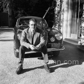 Car enthusiast Prince Rainier of Monaco at his Villa Iberia. He competed under the pseudonym of Louis Carladès at the Tour de France de l'automobile and crashed into a tree. Saint-Jean-Cap-Ferrat 1954. Car: Lancia Aurelia B20 Gran Turismo 2500 - Photo by Edward Quinn