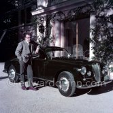 Car enthusiast Prince Rainier of Monaco at his Villa Iberia. He competed under the pseudonym of Louis Carladès at the Tour de France de l'automobile and crashed into a tree. Saint-Jean-Cap-Ferrat 1954. Car: Lancia Aurelia B20 Gran Turismo 2500 - Photo by Edward Quinn