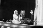 Prince Rainier of Monaco with Princess Caroline at the Palace window, on the day of the Baptism of Prince Albert, in Monaco-Ville, 20th April, 1958. - Photo by Edward Quinn