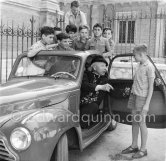 Father Tucker, prince Rainier’s prelate, with members of the youth orchestra of his parish. Beausoleil 1954. Car: 1950 Simca 6 - Photo by Edward Quinn