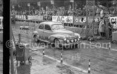 N° 129 Boeswillwald / Renaud on Peugeot 203, undergoing the breaking and starting test. Cars will have to accelerate as fast as possible for 200 metres from a standing start, and then pull up in the shortest possible distance, for the cars have to keep a line between the axles. Rallye Monte Carlo 1951. - Photo by Edward Quinn