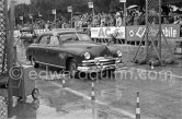 N° 158 Govers / van Hoevelken on Kaiser, undergoing the breaking and starting test. Cars will have to accelerate as fast as possible for 200 metres from a standing start, and then pull up in the shortest possible distance, for the cars have to keep a line between the axles. Rallye Monte Carlo 1951. - Photo by Edward Quinn