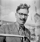 G. Warburton, co-driver of Sydney H. Allard, winner of Rallye MC 1952 on N° 146, Allard P1, 4,375 c.c. Ford V8 side-valve motor. He was the founder of the Allard car company and a successful racing motorist in cars of his own manufacture. Starting from Glasgow he narrowly defeated Stirling Moss, in a Sunbeam-Talbot 90, who finished second overall. Rallye Monte Carlo 1952. - Photo by Edward Quinn
