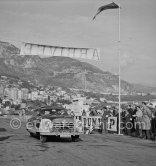 Dewez / Allais on Nash 600. Rallye Monte Carlo 1953. To prevent the competitors from taking the timekeepers by surprise and passing without being spotted the organisers decided to paint the front wings of the cars white with washable paint. This enabled the officials to identify them a long way off even if their rally plates were not easily visible because of dirt or their position on the car. (Louche p. 118) - Photo by Edward Quinn
