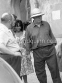 Jean Renoir in the gardens of "Les Collettes" (today Musée Renoir) director of  the film “Le Déjeuner sur l’herbe”. Behind him Catherine Rouvel.  Cagnes-sur-Mer 1959. - Photo by Edward Quinn