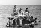 Gunter Sachs and friends on a Riva boat. Saint-Tropez 1961. - Photo by Edward Quinn