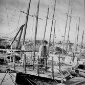 Françoise Sagan at the harbor. Yacht L'oiseau bleu. Cannes 1954. - Photo by Edward Quinn