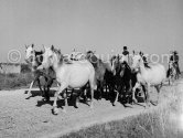 Camargue: Gardians arriving. Saintes-Maries-de-la-Mer in 1953. - Photo by Edward Quinn