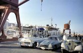 The cars of the Shah of Persia and his yacht Chashvar. Nice 1957. Car: Mercedes-Benz 300 SL, 1956 Chevrolet Bel Air convertible, Salmson S4 cabriolet - Photo by Edward Quinn