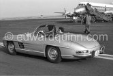 Princess Shanaz, daughter of the Shah of Persia and her husband, Ardeschir Zahedi. Nice Airport 1958. Car: Mercedes-Benz 300 SL - Photo by Edward Quinn