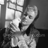 Simone Signoret, French actress often hailed as one of France’s greatest movie stars, on her wedding in 1951 to actor and singer Yves Montand. At the same restaurant Colombe d’Or, Saint-Paul-de-Vence, where their romance began. Special guest – a dove. - Photo by Edward Quinn