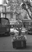 Georges Simenon on a market in Cannes 1955. - Photo by Edward Quinn