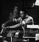 Georges Simenon at his desk. Villa Golden Gate, Cannes 1955. - Photo by Edward Quinn