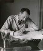 Georges Simenon at his desk. Villa Golden Gate, Cannes 1955. - Photo by Edward Quinn