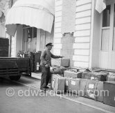 A valet counts Queen Soraya's luggage at Hotel Carlton, Cannes 1953. - Photo by Edward Quinn