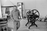 Graham Sutherland installing a printing press at La Villa Blanche. Menton 1974. - Photo by Edward Quinn