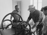 Graham Sutherland and a not yet identified person. installing a printing press at La Villa Blanche. Menton 1974. - Photo by Edward Quinn