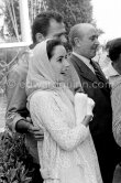 Liz Taylor and Mike Todd. A large lion cub was one 'of the more exotic guests invited by Mike Todd to the gala supper he hosted following the screening of "Around the World in 80 Days". Cannes 1957. - Photo by Edward Quinn